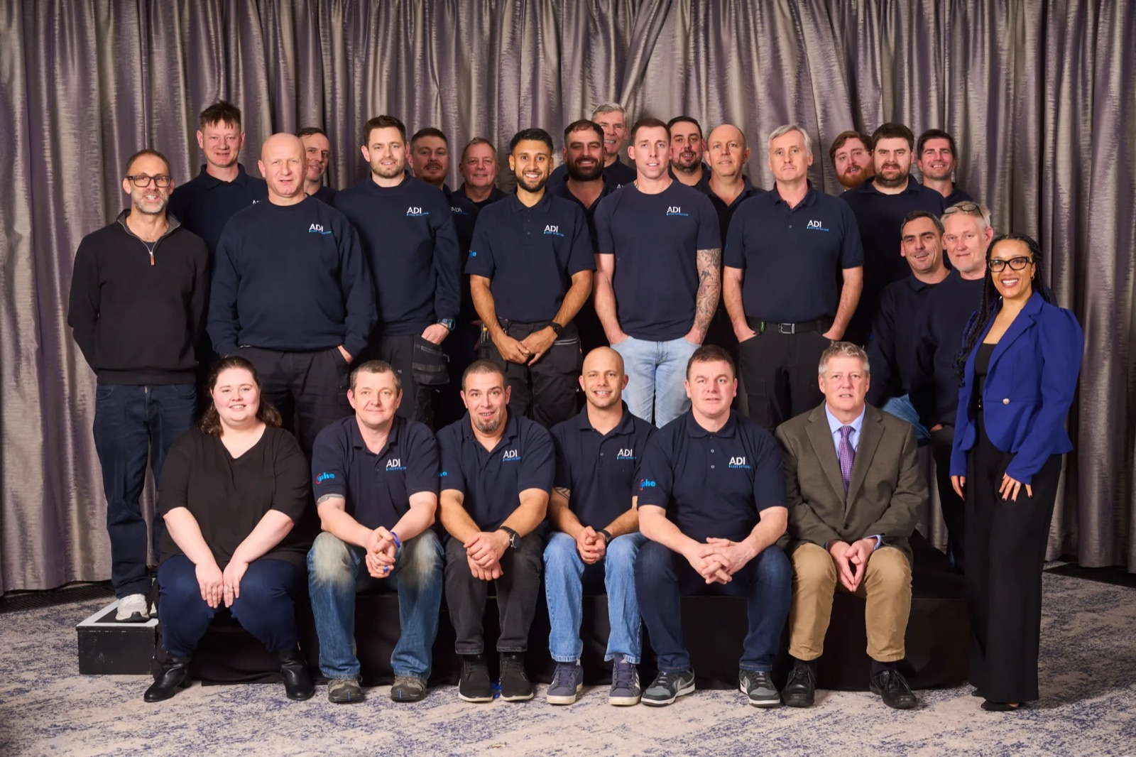 The ADI Leak Detection team: engineers and office staff in navy ADI polo shirts