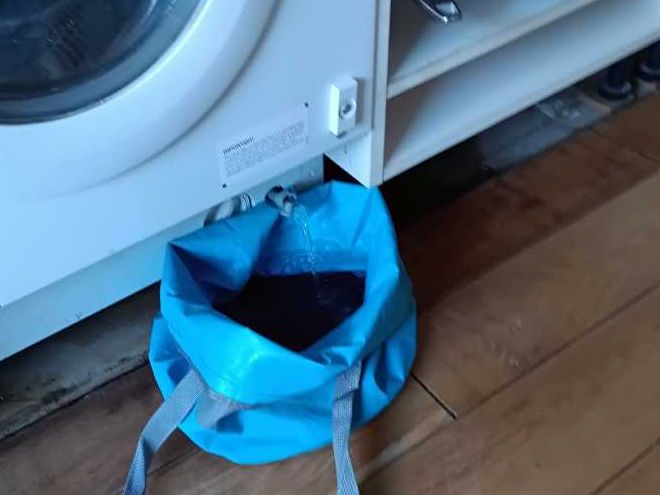 Testing the washing machine in the flat above, with the water caught in a bag