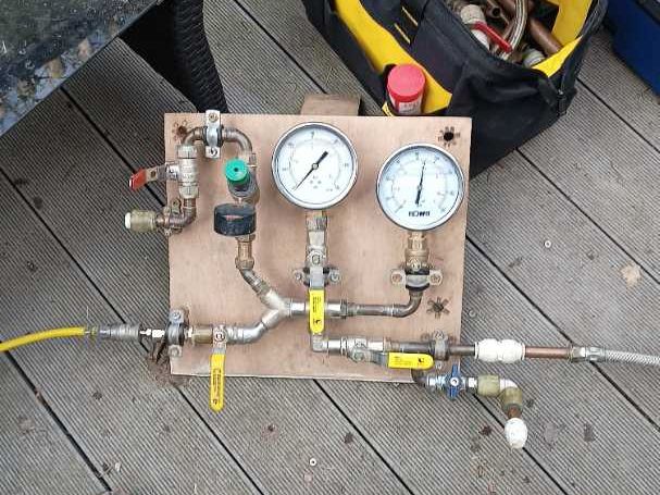 Our pressure testing rig set up on the job, with two gauges